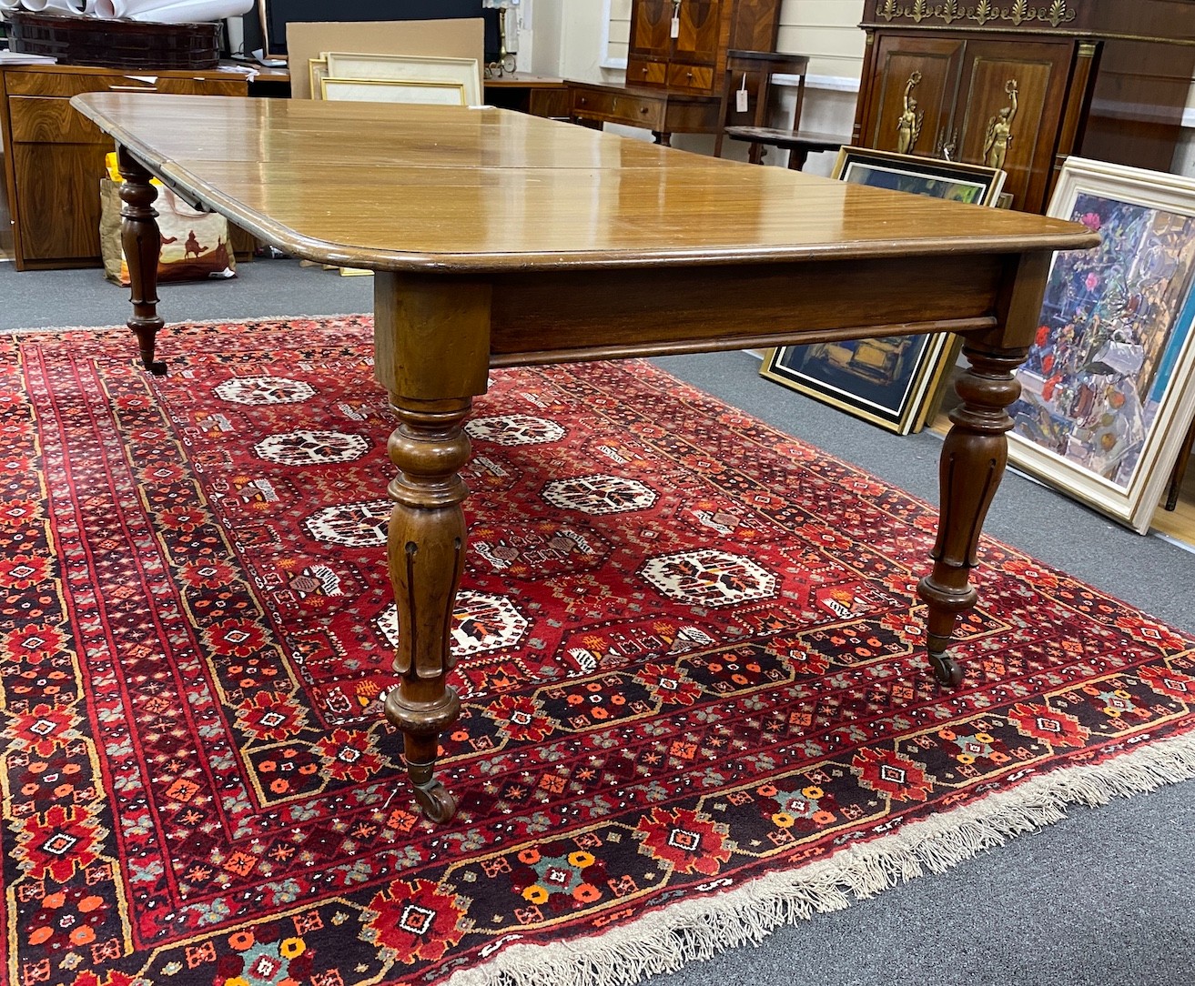 An early Victorian mahogany rectangular extending dining table, length 220cm extended, three spare leaves, width 120cm, height 73cm